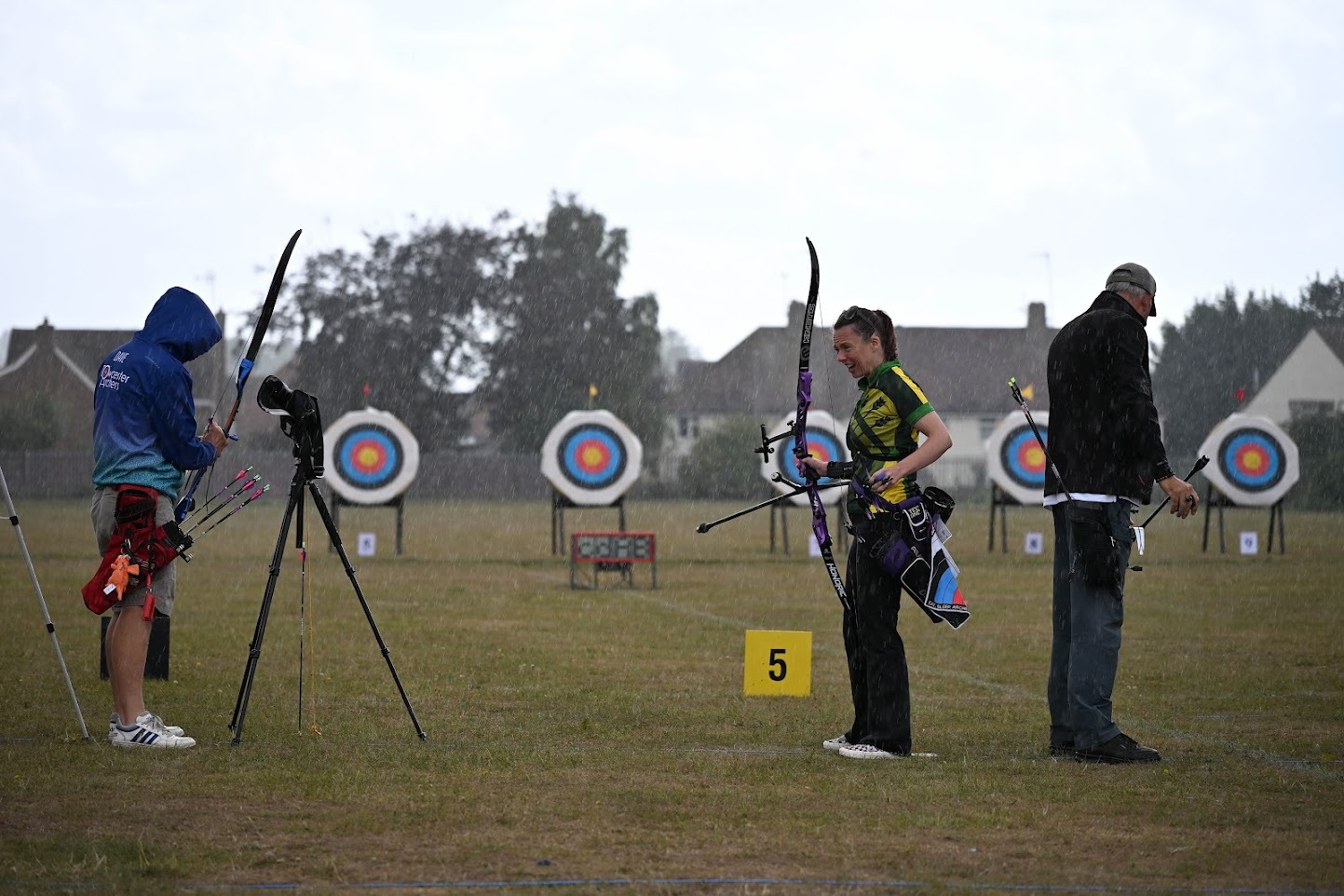Club members shooting in the rain